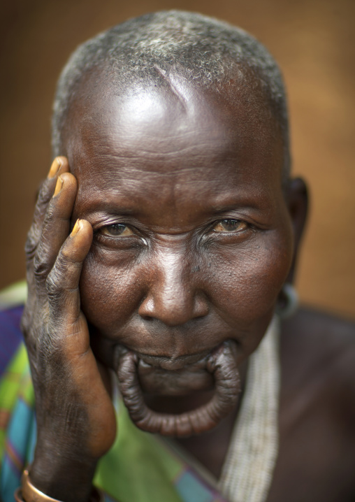 Suri tribe woman with a stretched lip, Kibish, Omo valley, Ethiopia