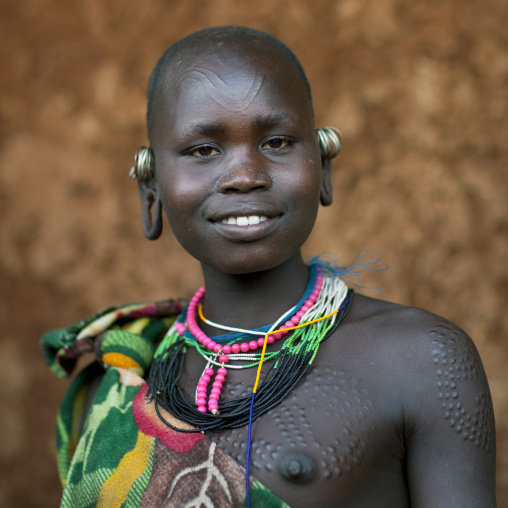 Suri tribe woman with traditional scarifications, Kibish, Omo valley, Ethiopia