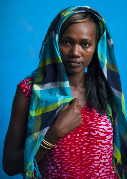 Young waitress with a veil in hana mursi hotel, Omo valley, Ethiopia