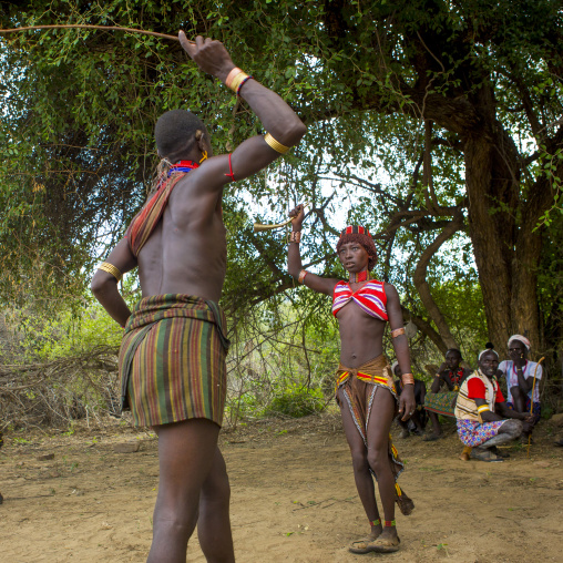 Whipping During Bull Jumping Ceremony In Hamar Tribe, Turmi, Omo Valley, Ethiopia
