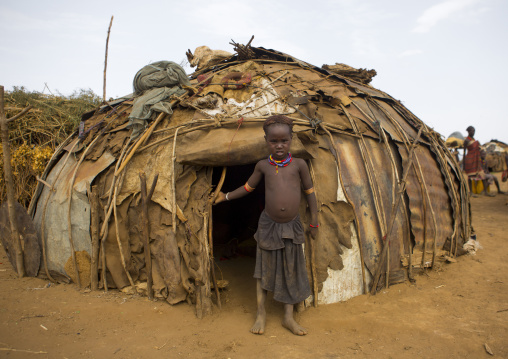 Dassanech Tribe Boy Standing In Front Of His House, Omorate, Omo Valley, Ethiopia