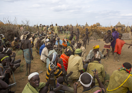Dassanech Tribe Warriors Sharing Cow Meat During A Ceremony, Omorate, Omo Valley, Ethiopia