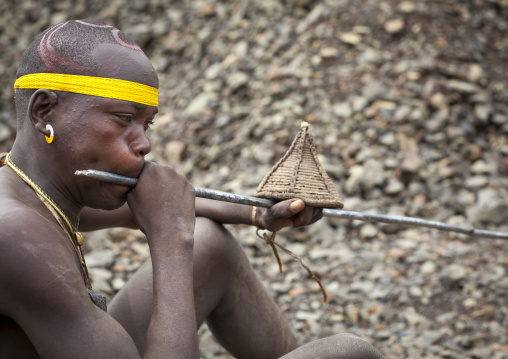 Bodi Tribe Blowing In A Local Trumpet For Kael Ceremony, Hana Mursi, Omo Valley, Ethiopia