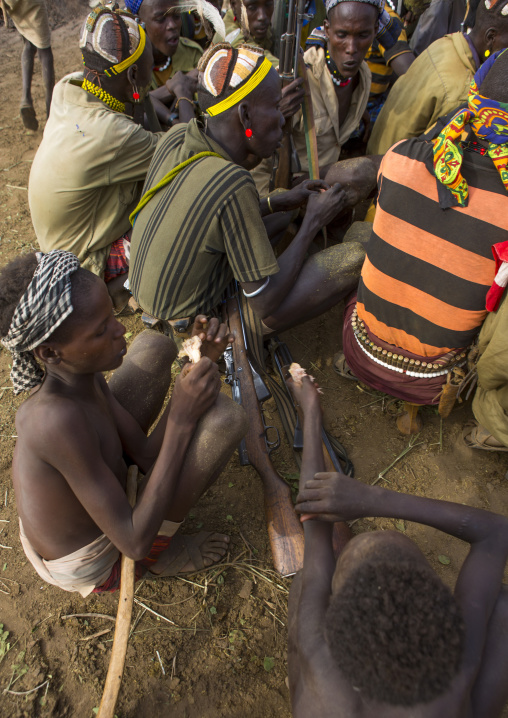 Dassanech Tribe Warriors Sharing Cow Meat During A Ceremony, Omorate, Omo Valley, Ethiopia