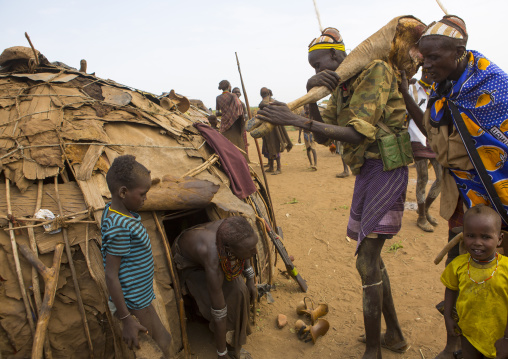 Dassanech Tribe Man Bringing Back Home Cow Meat During A Ceremony, Omorate, Omo Valley, Ethiopia