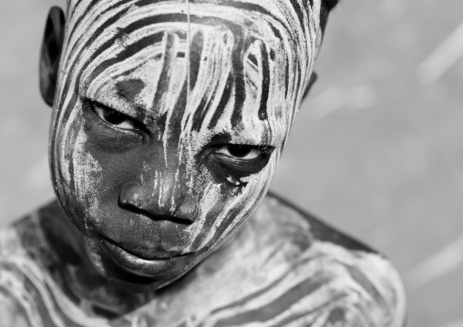 Portrait Of Young Provocative Look Mursi Boy Ethiopia
