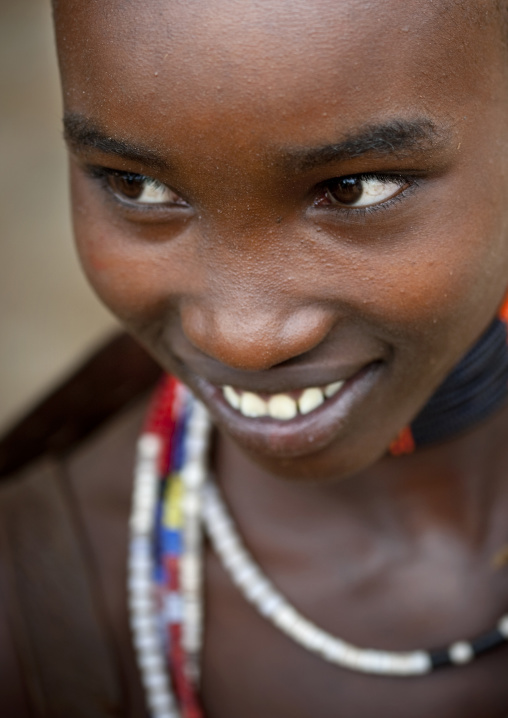 Portrait Of A Smilling Teenage Hamer Tribe Girl, Omo Valley, Ethiopia