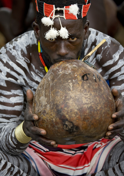 Portrait Of A Karo Tribe Man With Body Paintings Drinking Sorghum Beer From A Calabash, Korcho, Ethiopia