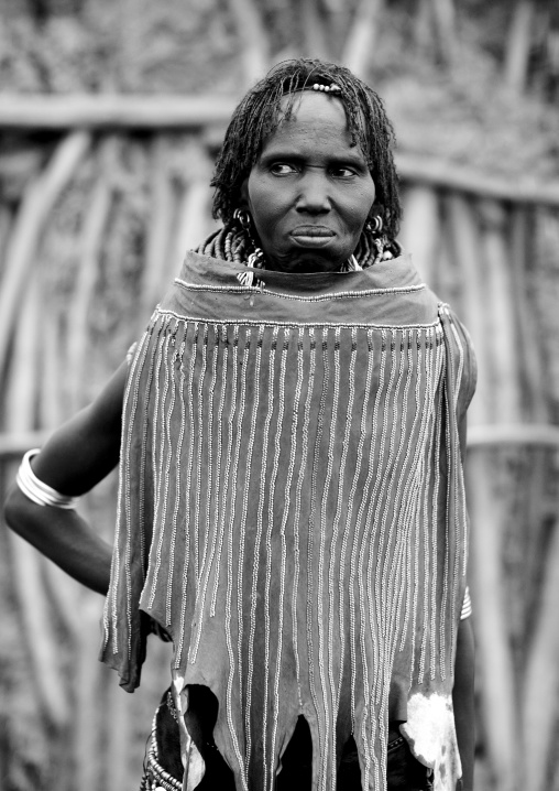 Black And White Portrait Of A Topossa Woman, With Traditional Clothes, Omo Valley, Kangate, Ethiopia