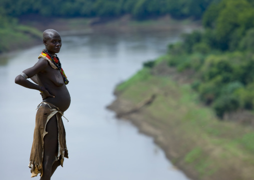 Portrait Of A Pregnant Woman From Karo Tribe Over The Omo River, Korcho Village, Omo Valley, Ethiopia