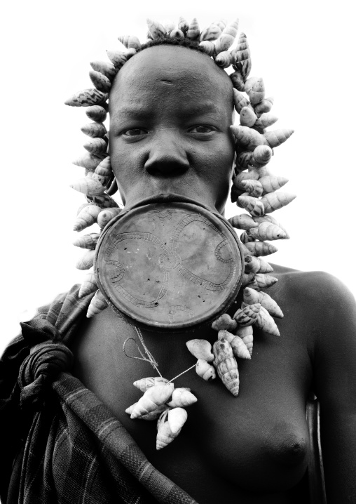 Black And White Portrait Of A Mursi Tribe Woman With Lip Plate And Enlarged Ears In Mago National Park, Omo Valley, Ethiopia