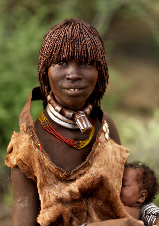 Portrait Of A Hamar Tribe Woman With Traditional Hairstyle And Newborn, Turmi, Omo Valley, Ethiopia