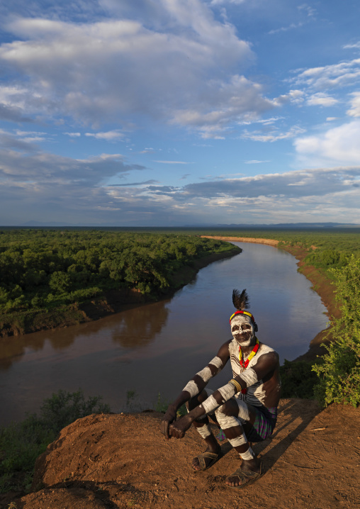 Portrait Of A Karo Tribe Man With Body Paintings And Traditional Hairstyle Over The Omo River, Korcho Village, Omo Valley, Ethiopia