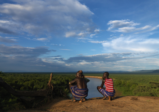 Karo Tribe Men Squatting Over The Omo River, Korcho Village, Omo Valley, Ethiopia