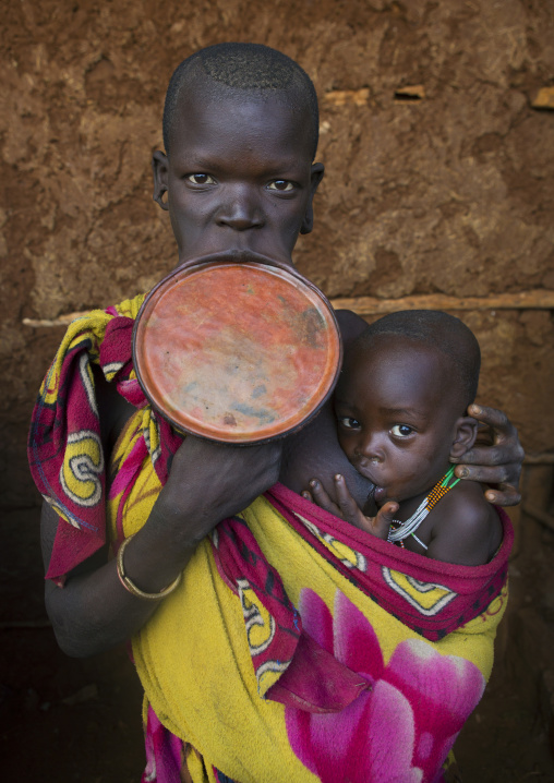 Suri Tribe Woman With A Lip Plate And Her Baby, Kibish, Omo Valley, Ethiopia