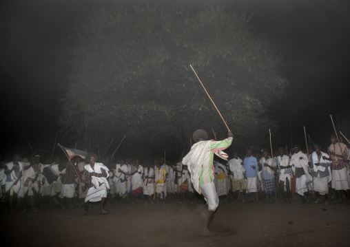 Night Shot Of Two Karrayyu Tribe Men During A Choreographed Stick Fighting Dance At Gadaaa Ceremony, Metahara, Ethiopia