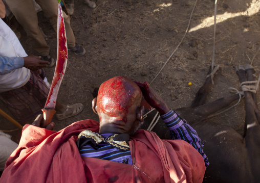 View From Above Of Former Karrayyu Tribe Leader Putting Cow Blood On His Head In Sign Of Abdication During Gadaaa Ceremony, Metehara, Ethiopia