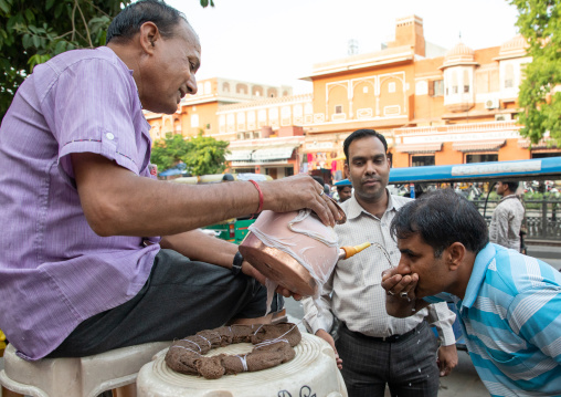 Indian volunteer distributing water for free during the heat wave, Rajasthan, Jaipur, India
