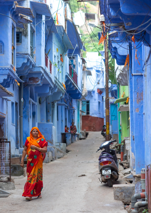 Rajasthani woman in traditional sari in the blue houses, Rajasthan, Bundi, India