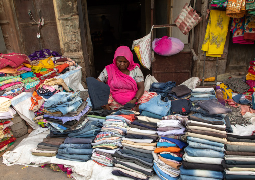 Indian woman selling textiles in the street, Rajasthan, Bikaner, India