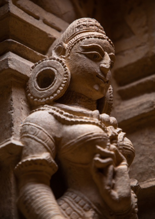 Golden coloured sandstone statue inside inside the jain temple, Rajasthan, Jaisalmer, India