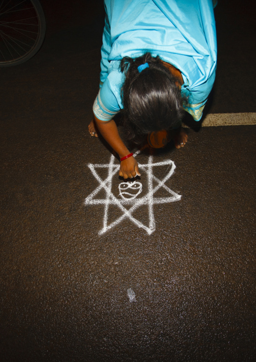 Woman In Sari Bent Down Drawing Drawing Kolam For A Ceremony In The Street, Trichy, India