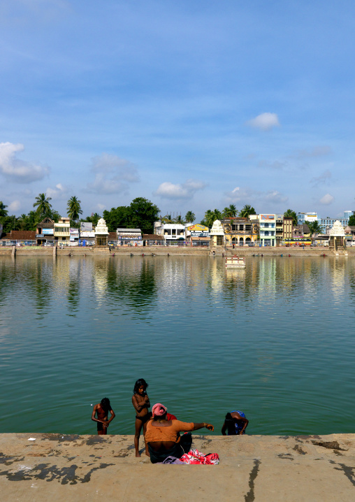 Children Taking A Bath Under The Supervision Of Their Mother In The Mahamaham Tank, Kumbakonam, India
