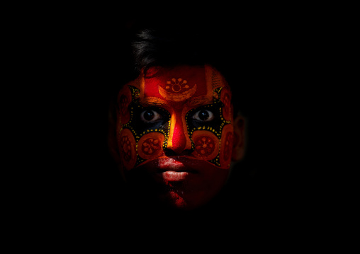 Man With Traditional Makeup On His Face For Theyyam Ceremony, Thalassery, India