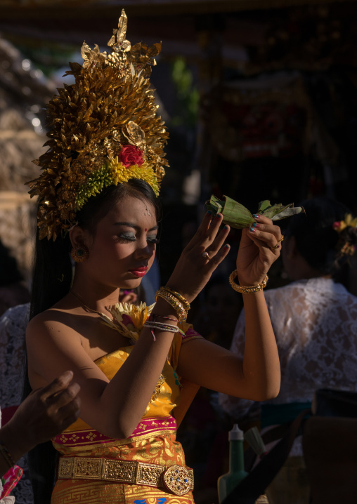 A Teenager Girl In Traditional  Costume Praying Before A Tooth Filing Ceremony