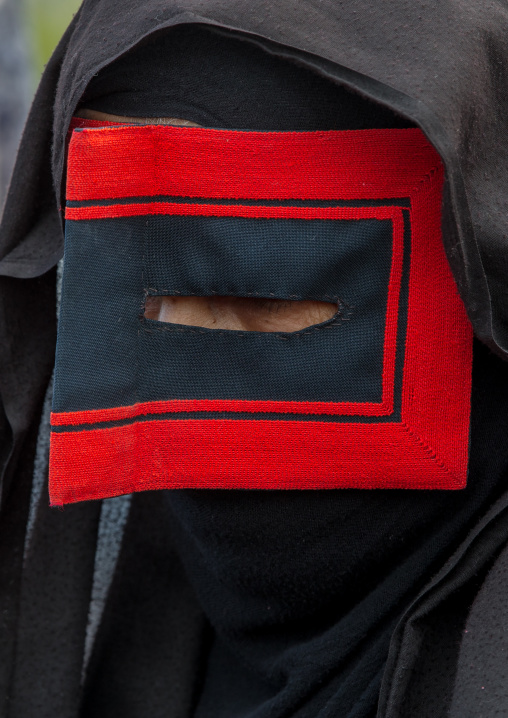 a bandari woman wearing a traditional mask called the burqa at panjshambe bazar thursday market, Hormozgan, Minab, Iran