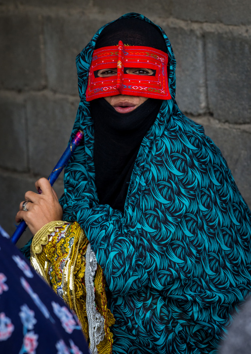 a bandari woman wearing a traditional mask called the burqa at panjshambe bazar thursday market, Hormozgan, Minab, Iran