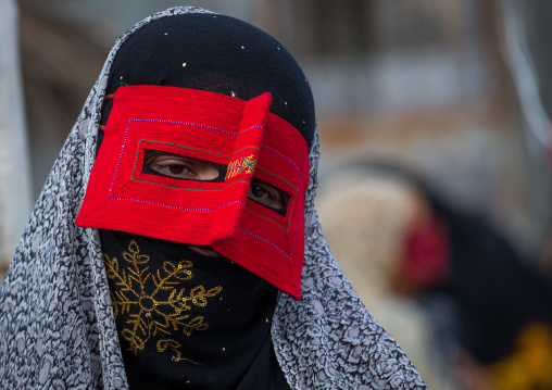a bandari woman wearing a traditional mask called the burqa at panjshambe bazar thursday market, Hormozgan, Minab, Iran
