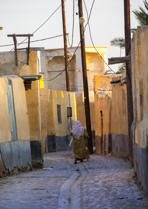 woman walking in the street, Qeshm Island, Laft, Iran