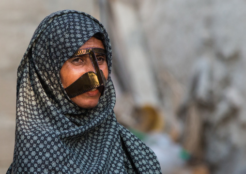 a bandari woman wearing a traditional mask called the burqa, Qeshm Island, Salakh, Iran