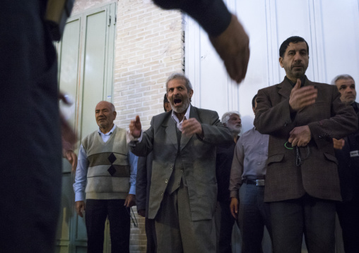 Men weeping and mourning in the bazaar, Isfahan province, Isfahan, Iran
