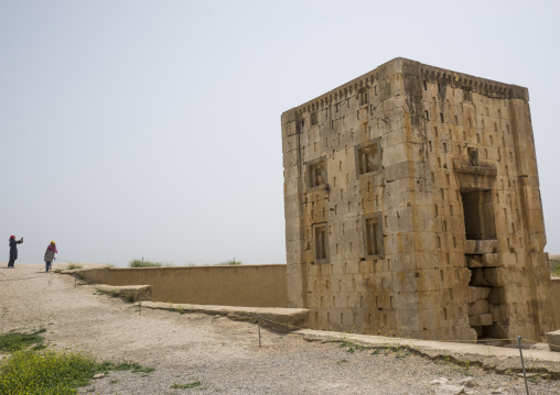 Iranian women taking pictures in front of ka'ba-ye zartosht, Fars province, Shiraz, Iran