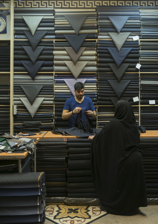 Fabric store with stacks of textiles in the bazaar, Shemiranat county, Tehran, Iran