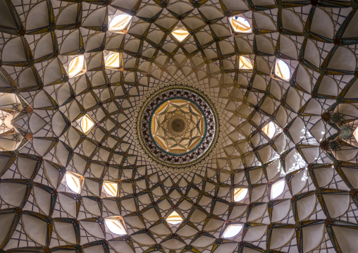 Ceiling with its intricate and elaborate patterns and internal stainless glass dome the boroujerdi house, Isfahan province, Kashan, Iran