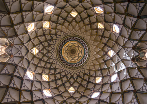 Ceiling with its intricate and elaborate patterns and internal stainless glass dome the boroujerdi house, Isfahan province, Kashan, Iran