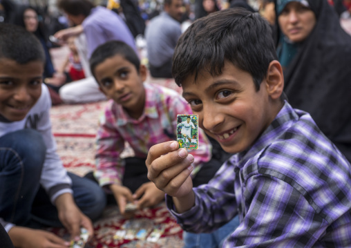 Pilgrim child showing a ronaldo sticker at the shrine of fatima al-masumeh, Qom province, Qom, Iran