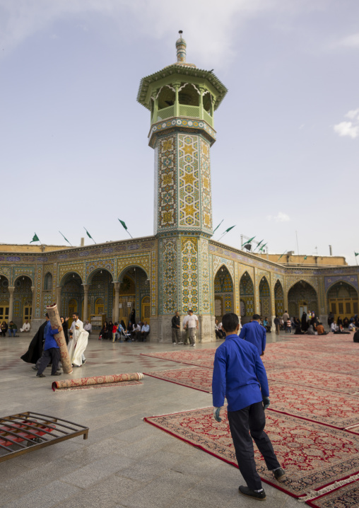 Men putting carpets for praying in the shrine of fatima al-masumeh, Qom province, Qom, Iran