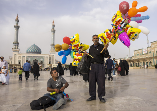 Men selling balloons in front of imam hassan mosque, Qom province, Qom, Iran