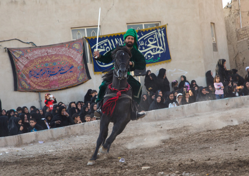 Man riding a horse during a traditional religious theatre called tazieh about Imam Hussein death in Kerbala, Isfahan Province, Isfahan, Iran