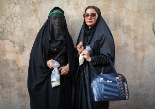 Two iranian shiite women Mourning Imam Hussein On The Day Of Tasua, Lorestan Province, Khorramabad, Iran