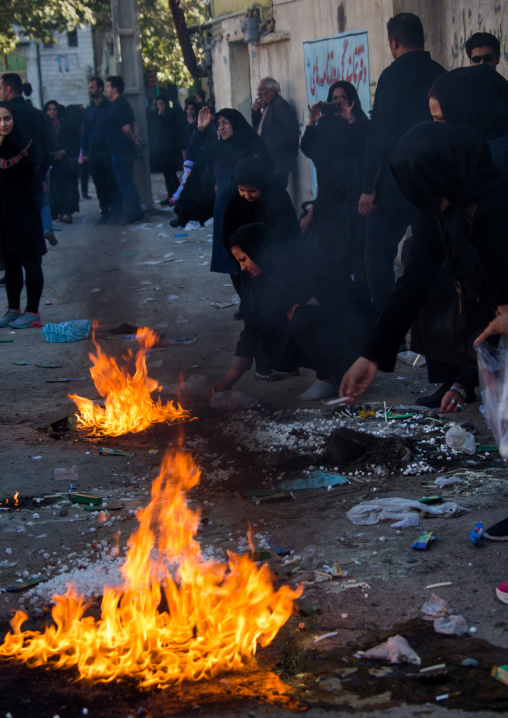 Iranian shiite people light candles and put sugar cubes during Chehel Manbar ceremony on Tasua to commemorate the martyrdom anniversary of Hussein, Lorestan Province, Khorramabad, Iran