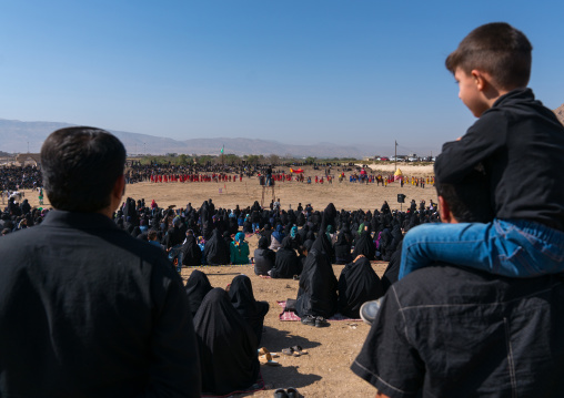 Iranian people looking at a traditional religious theatre called tazieh about Imam Hussein death in Kerbala, Lorestan Province, Khorramabad, Iran