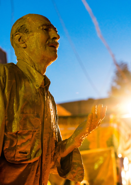 Iranian shiite muslim man crying after rubbing mud on his body during the Kharrah Mali ritual to mark the Ashura ceremony, Lorestan Province, Khorramabad, Iran