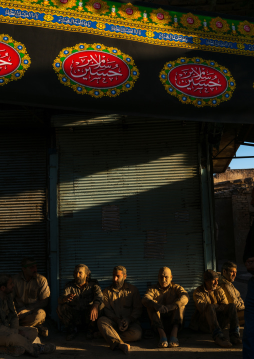 Iranian shiite muslim men with mud stains during the Ashura day, Lorestan Province, Khorramabad, Iran