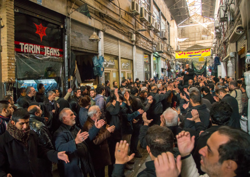 iranian shiite muslim men celebrating ashura in the bazaar, Central district, Tehran, Iran