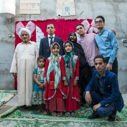 groom posing with his relatives during a wedding ceremony, Qeshm Island, Salakh, Iran